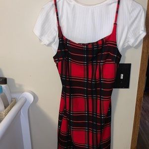 red and black dress with a white shirt under it